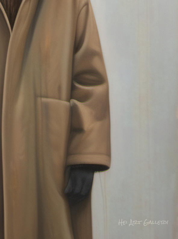 Close-up of a beige coat with a blurred background
