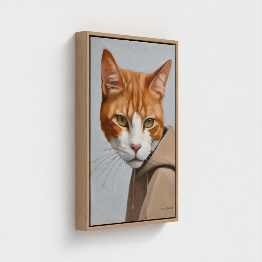 Framed artwork of a cat's face on a white wall