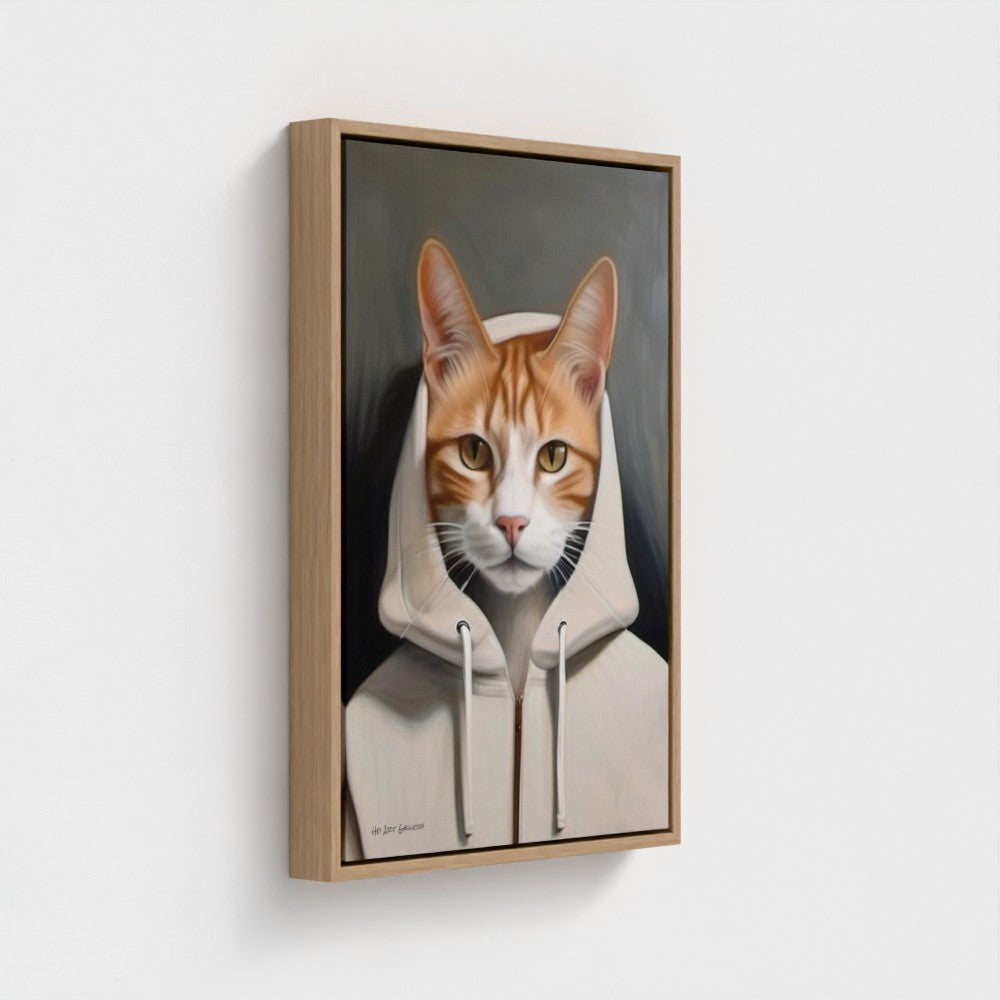 Framed artwork of a cat wearing a hoodie on a white wall