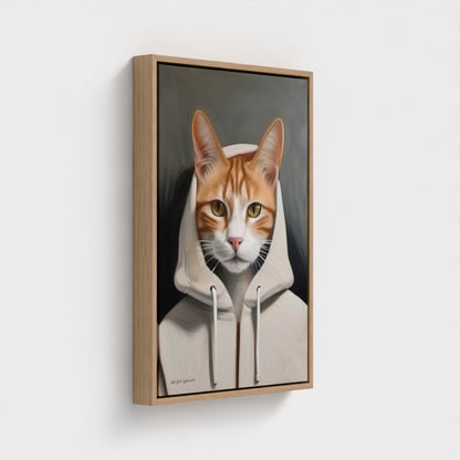 Framed artwork of a cat wearing a hoodie on a white wall