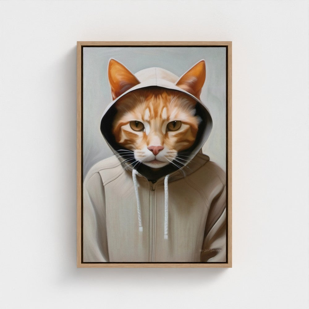 Framed artwork of a cat wearing a hoodie on a white wall
