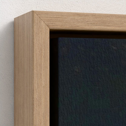 Close-up of a wooden picture frame corner on a white wall.