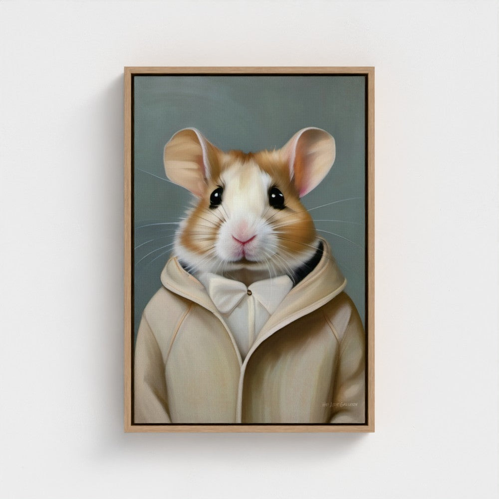Framed artwork of a hamster wearing a beige hoodie on a white wall.
