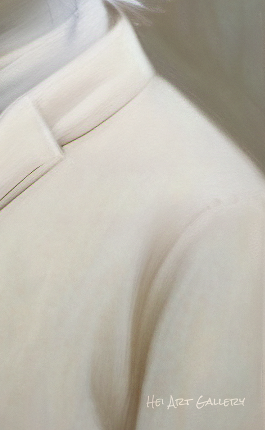 Close-up of a beige suit jacket with a blurred background