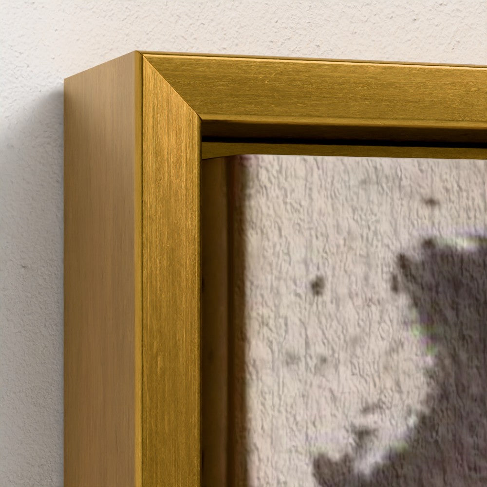 Gold framed picture on a textured wall