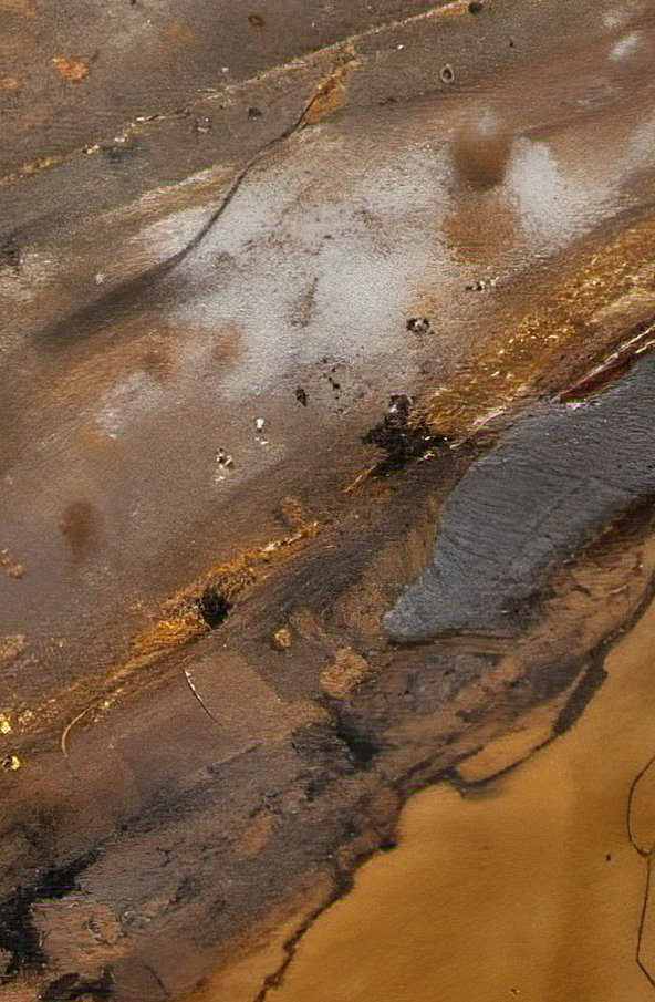 Close-up of a textured surface with brown, beige, and gray colors