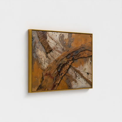 Abstract art piece with gold and brown tones on a white wall