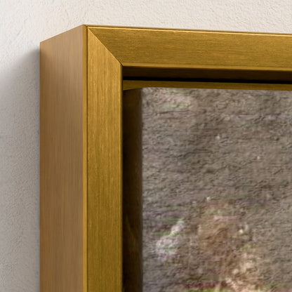 Gold framed mirror on a textured wall