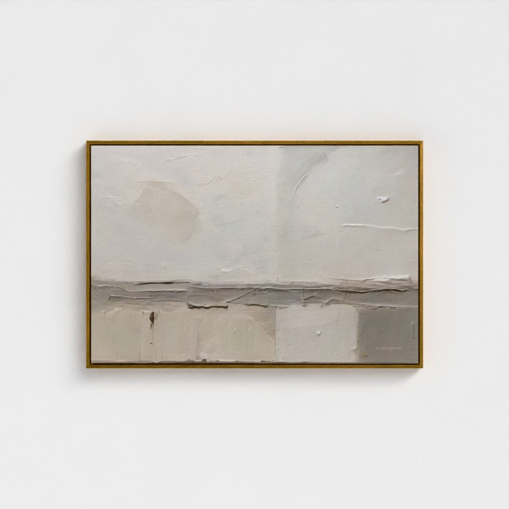 Abstract painting in a gold frame on a white wall