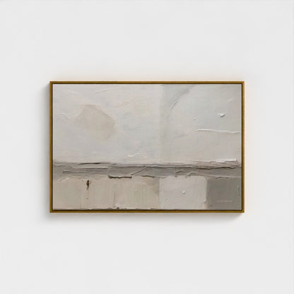 Abstract painting in a gold frame on a white wall