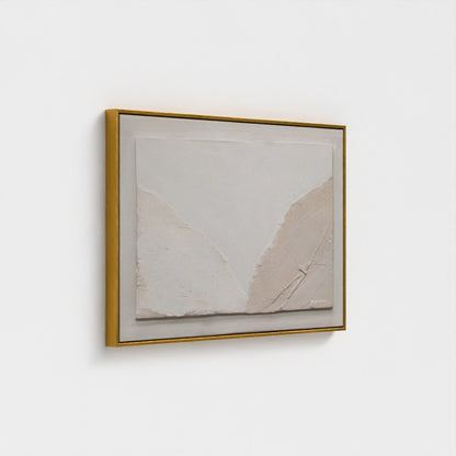 Framed abstract art piece on a white wall