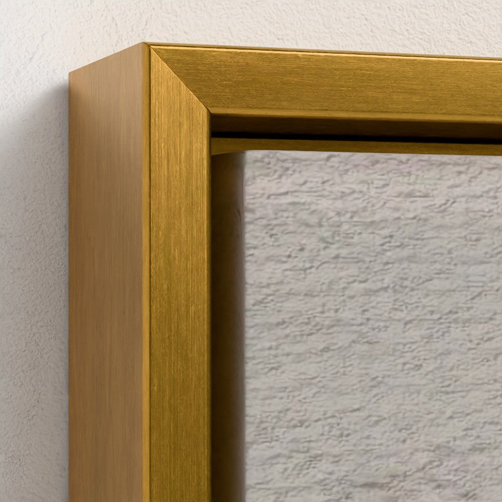 Close-up of a gold picture frame corner on a textured wall.