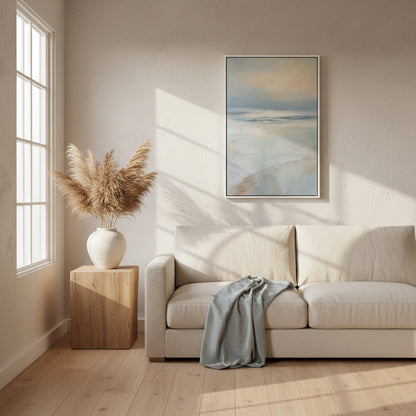 Living room with a beige sofa, wooden side table with a vase, and abstract painting on the wall.