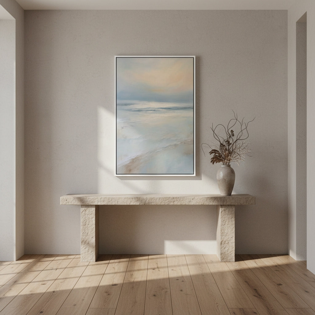 Modern interior with a stone console table and abstract painting on a neutral wall.
