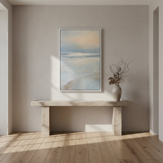 Modern interior with a stone console table and abstract painting on a neutral wall.