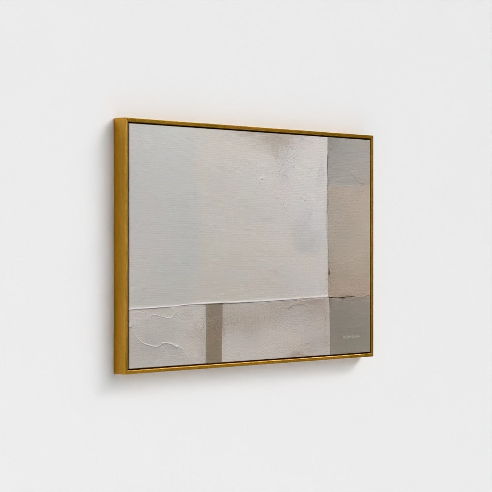Square mirror with gold frame on a white wall