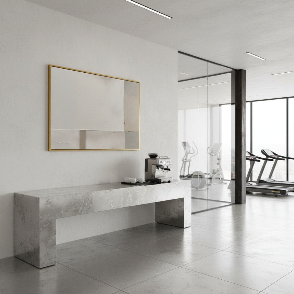 Modern kitchen setup with a marble countertop and coffee machine in a bright room.