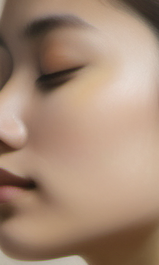 Close-up of a person's face with a blurred background