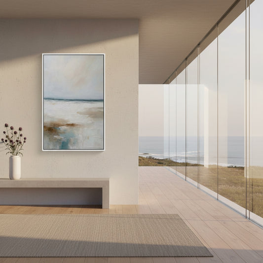 Modern interior with abstract painting on wall and view of ocean through glass doors