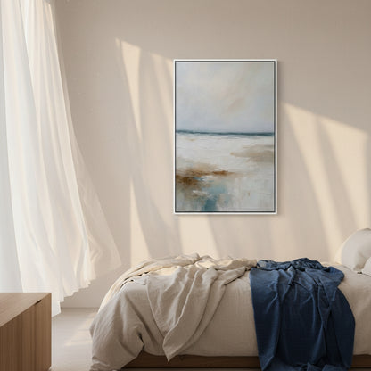 Framed abstract art above a bed with natural light filtering through curtains