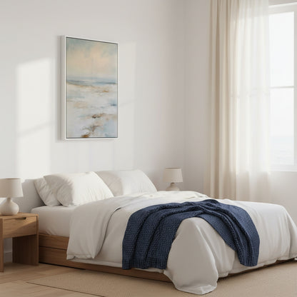 Modern bedroom with a bed, nightstands, and abstract wall art.