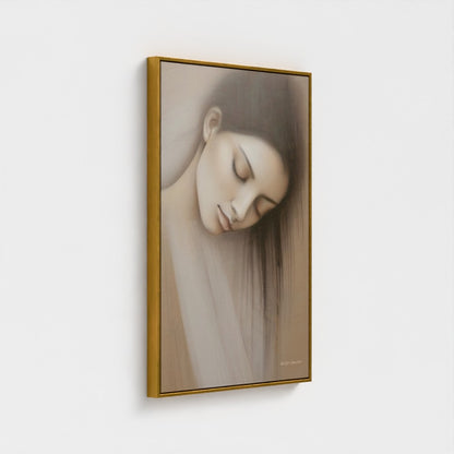 Framed artwork of a woman's face with a gold frame on a white background