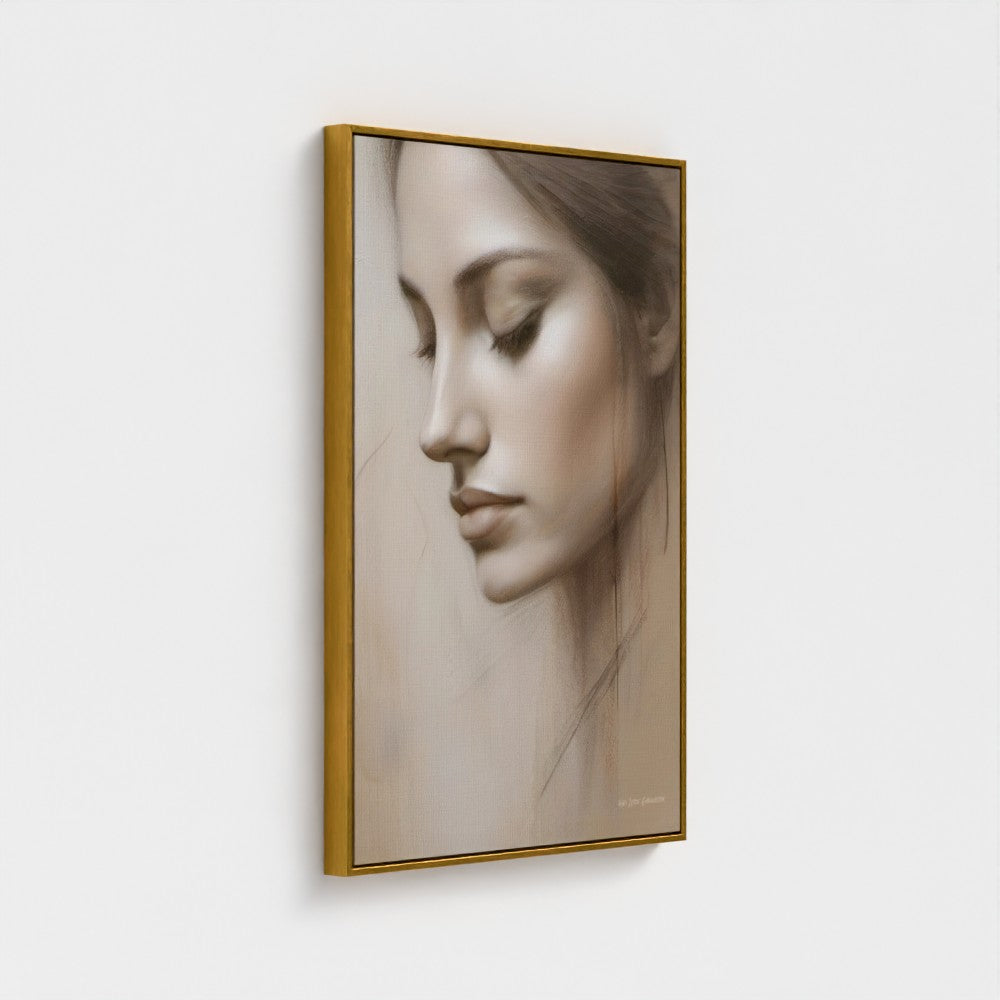 Framed artwork of a woman's face on a white wall