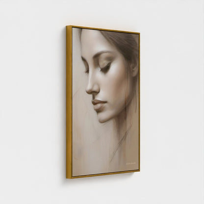 Framed artwork of a woman's face on a white wall
