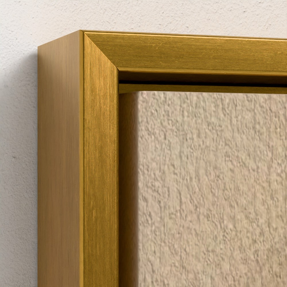 Gold picture frame corner on a textured beige wall