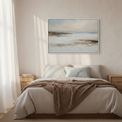 Bedroom with a bed, brown blanket, and framed artwork on the wall.
