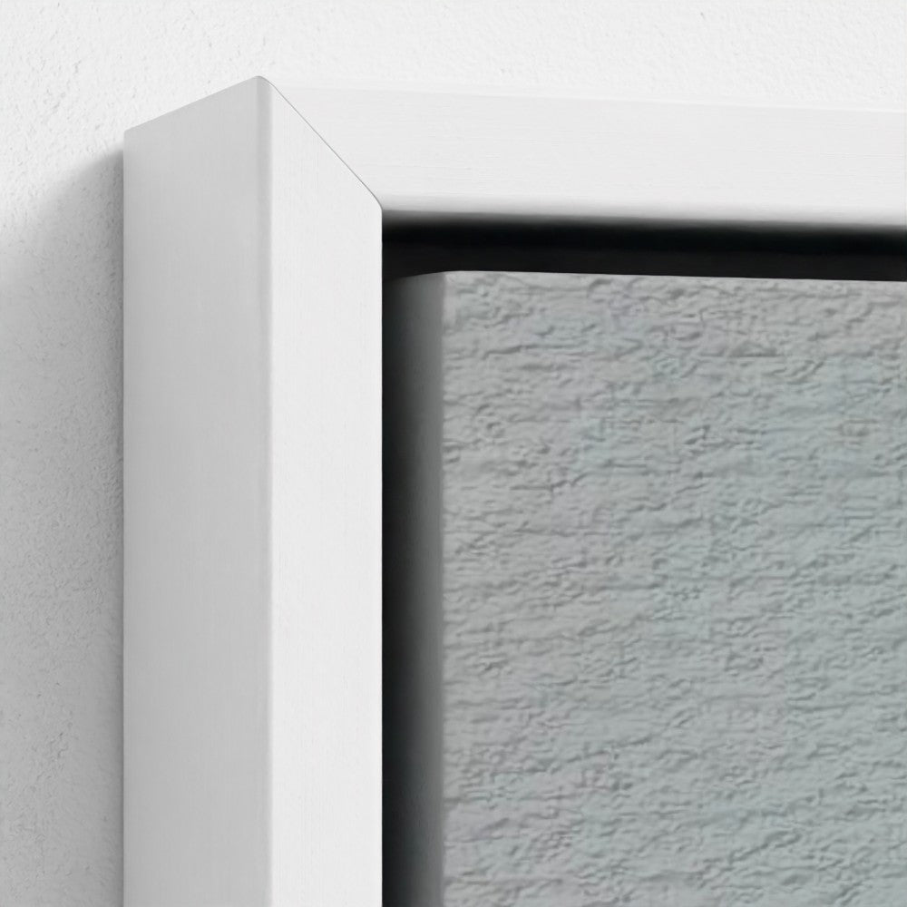 Close-up of a textured wall with a white frame corner.