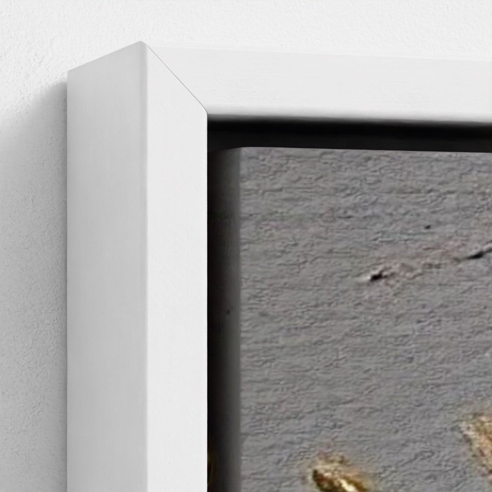 Close-up of a white frame corner on a textured gray surface