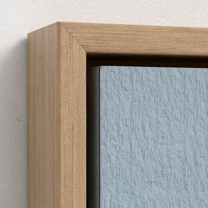 Close-up of a wooden picture frame with a light blue wall background
