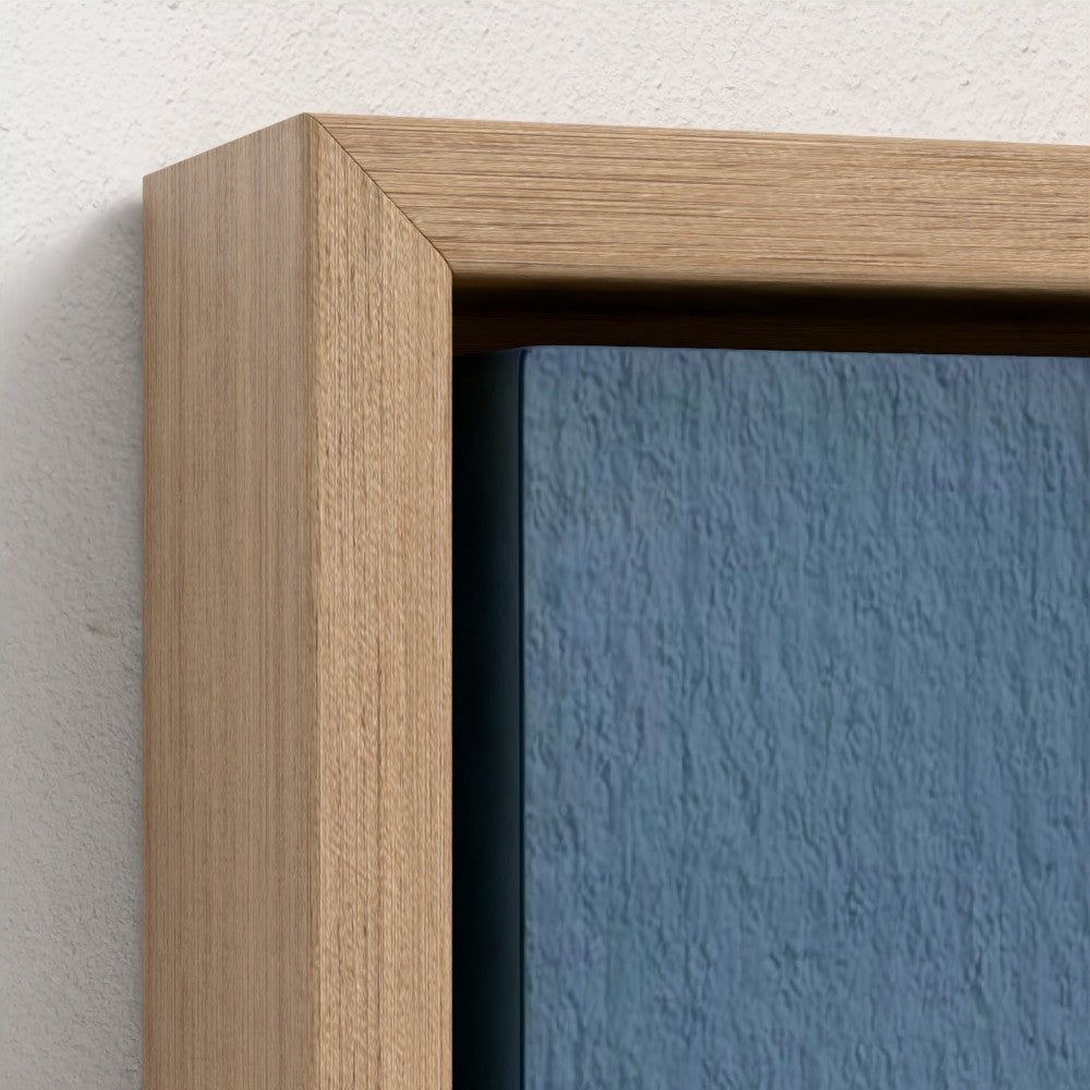 Close-up of a wooden frame with a blue textured painting inside.