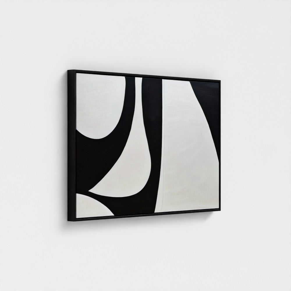 Abstract black and white artwork on a white wall
