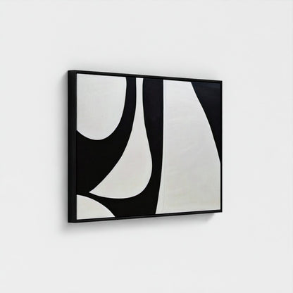 Abstract black and white artwork on a white wall