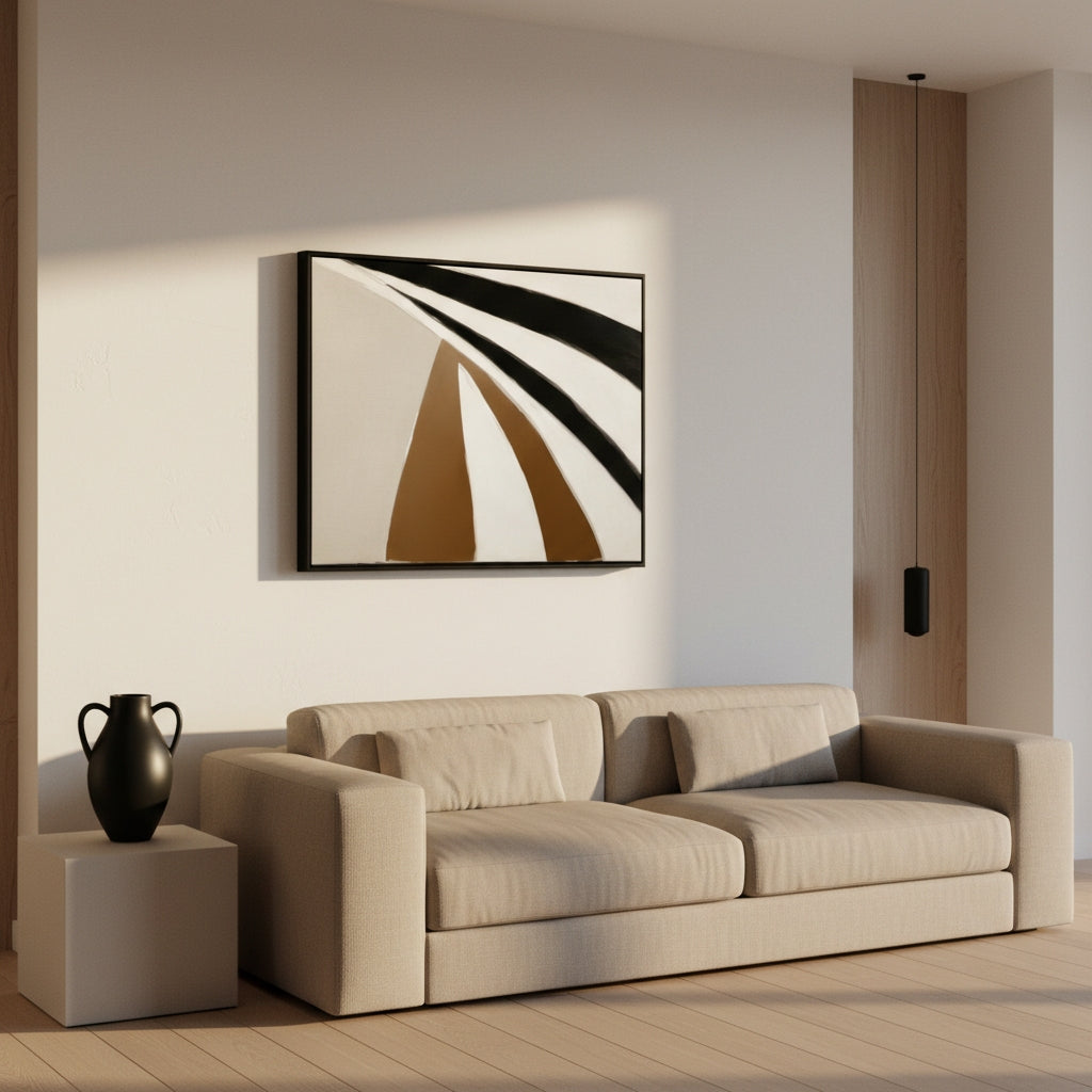 Beige sofa in a living room with abstract art on the wall