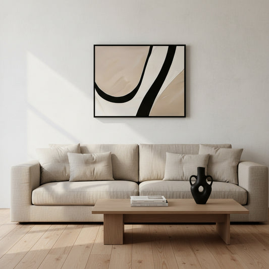 Modern living room with a beige sofa, wooden coffee table, and abstract art on the wall.