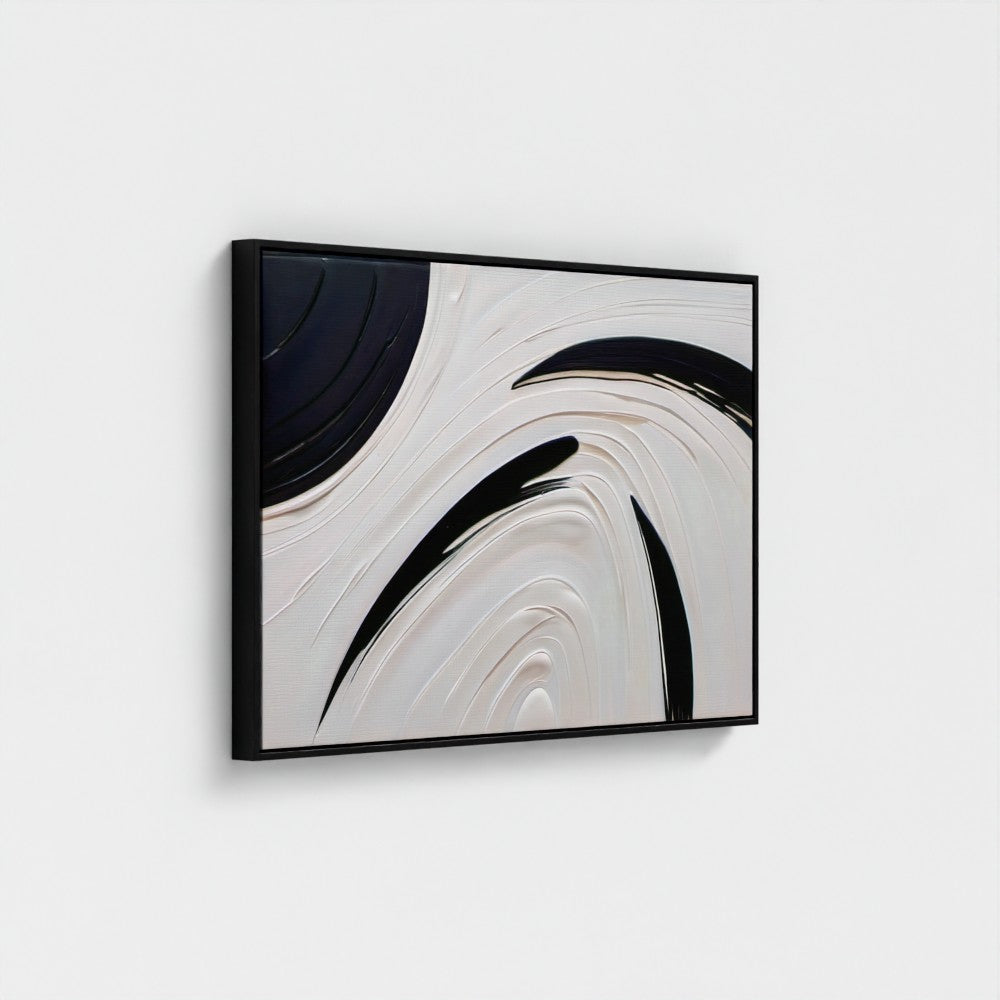 Abstract art piece with black and white swirls in a black frame on a light gray background