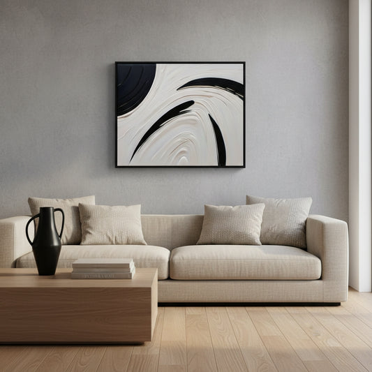 Modern living room with a beige sofa, wooden coffee table, and abstract art on the wall.