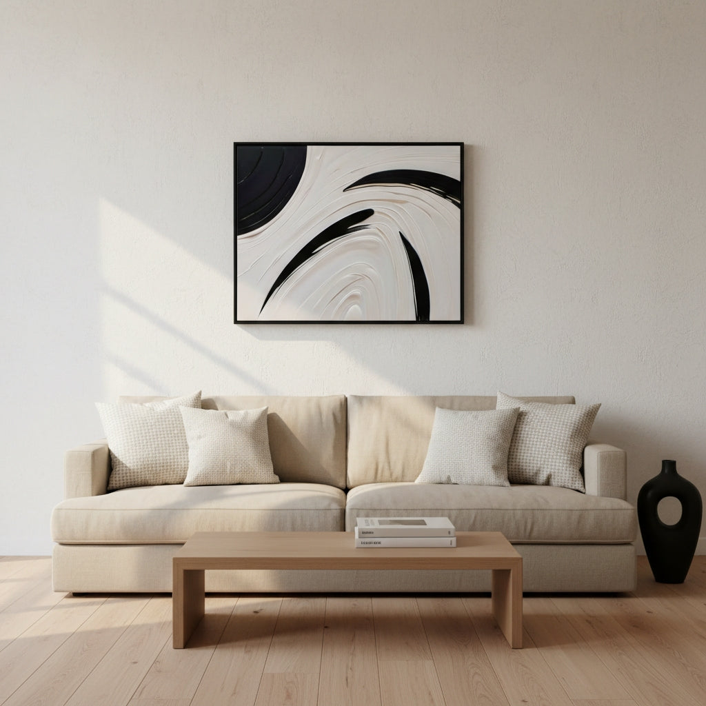 Modern living room with a beige sofa, wooden coffee table, and abstract art on the wall.