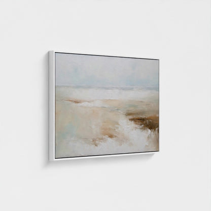 Framed artwork of a landscape with water and sky on a white wall
