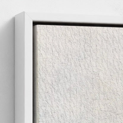 Close-up of a textured white canvas with a black border on a light gray background