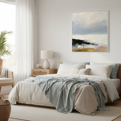 Cozy bedroom with a bed, lamp, and wall art