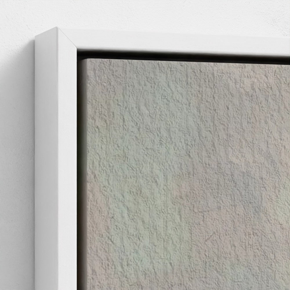 Close-up of a textured wall with a white frame.