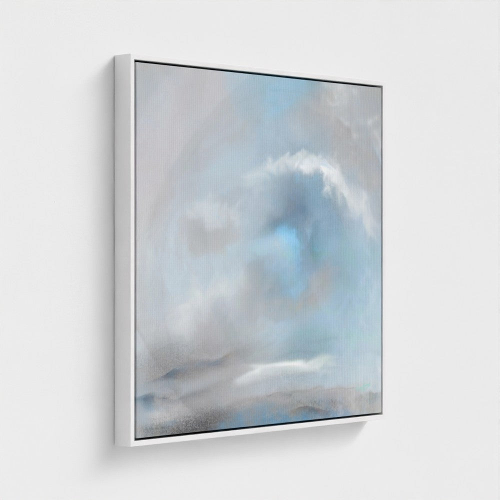 Framed artwork of a cloud on a white wall