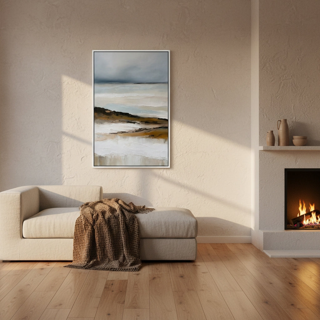 Living room with a sofa, fireplace, and abstract painting on the wall.
