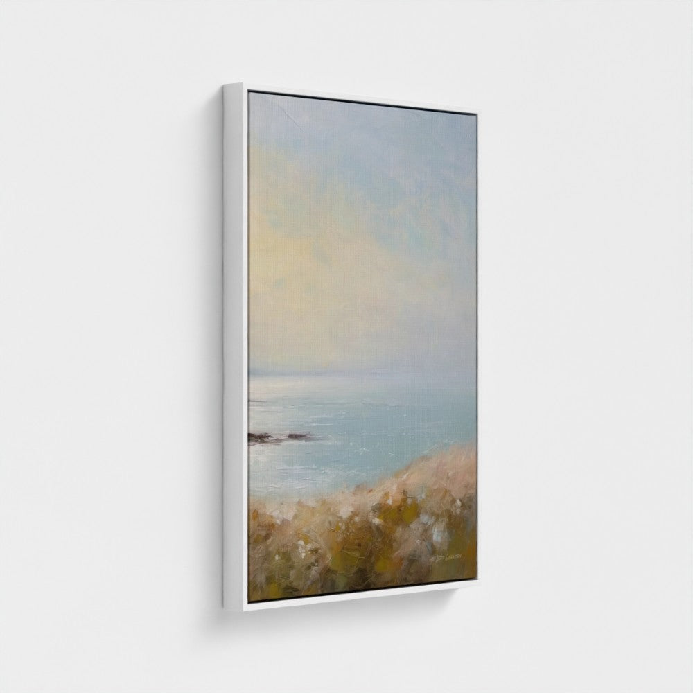 Framed artwork of a beach scene with a gradient sky.