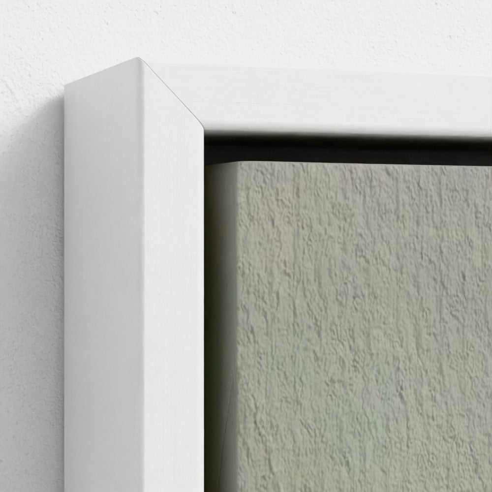 Close-up of a white frame corner with a textured gray background