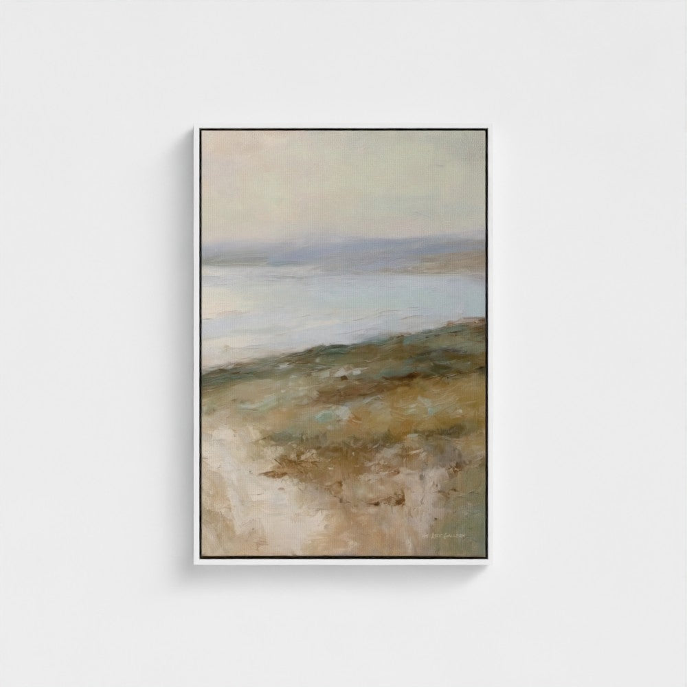 Framed abstract landscape painting on a white wall